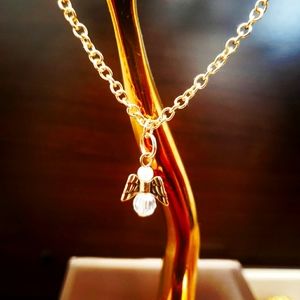 Gold dainty necklace with beaded angel